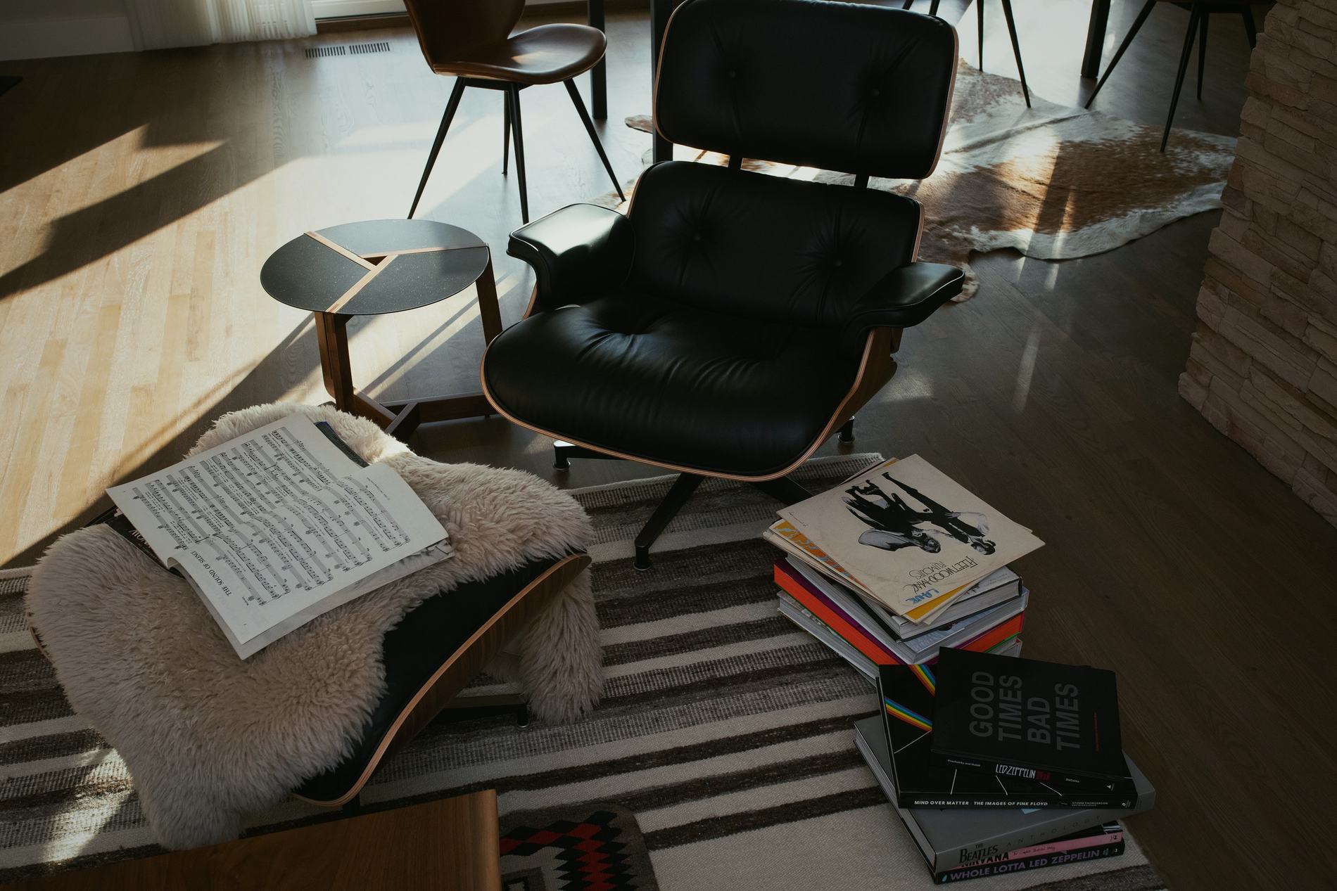 Remodeled living room with lounge chair in afternoon light, Fort Collins